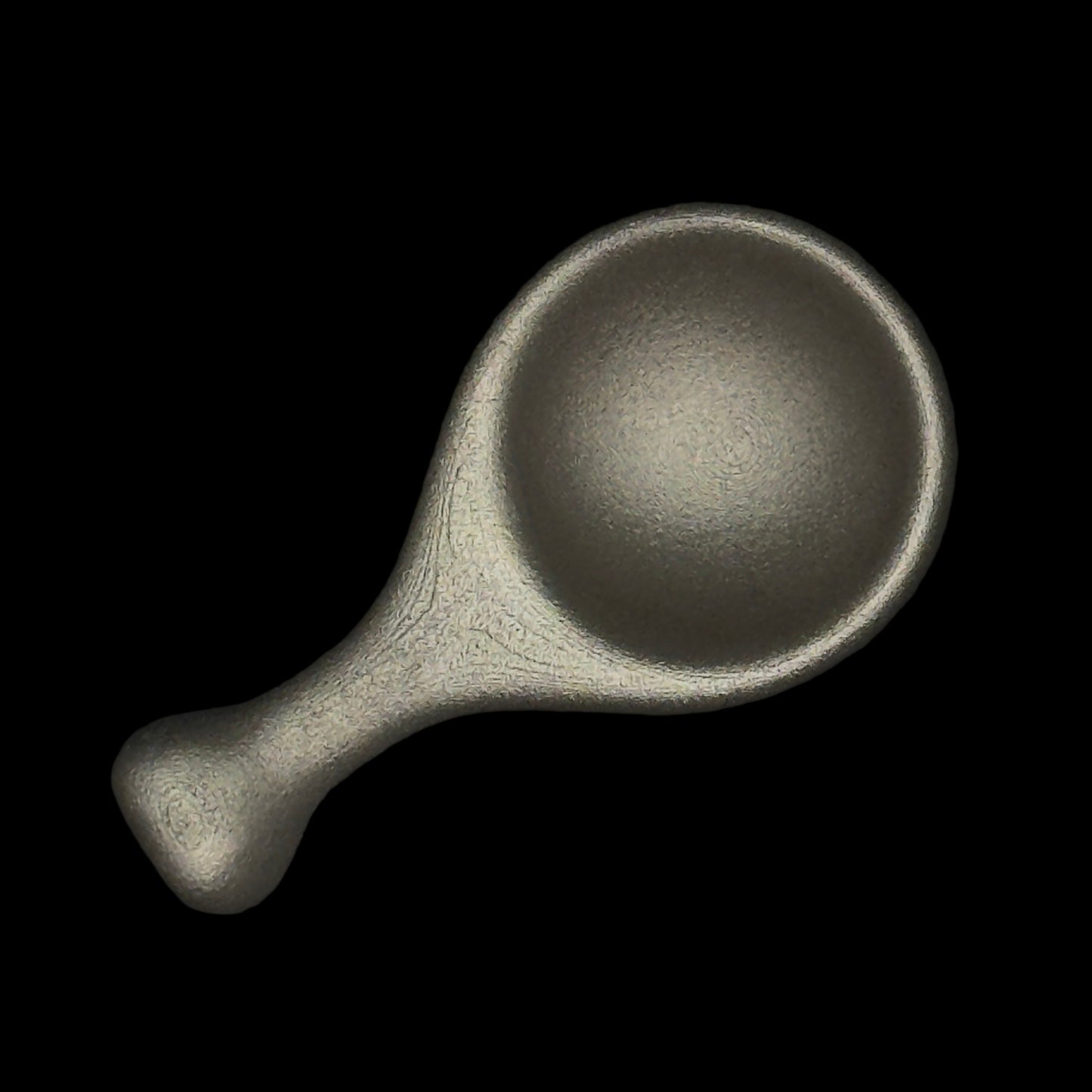 Metal scoop on a dark background